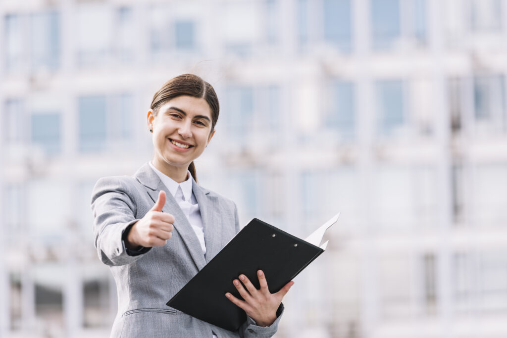 Professional Woman with Clipboard - Representing Career Opportunities at Omkar Industries